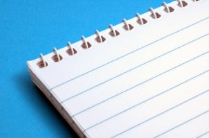 Image of a notepad on a blue background for an article about What are eSourcing Best Practices?.